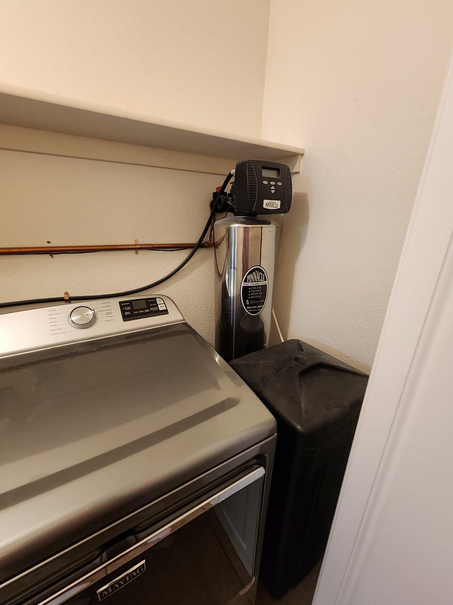 Water softener within full inside laundry room