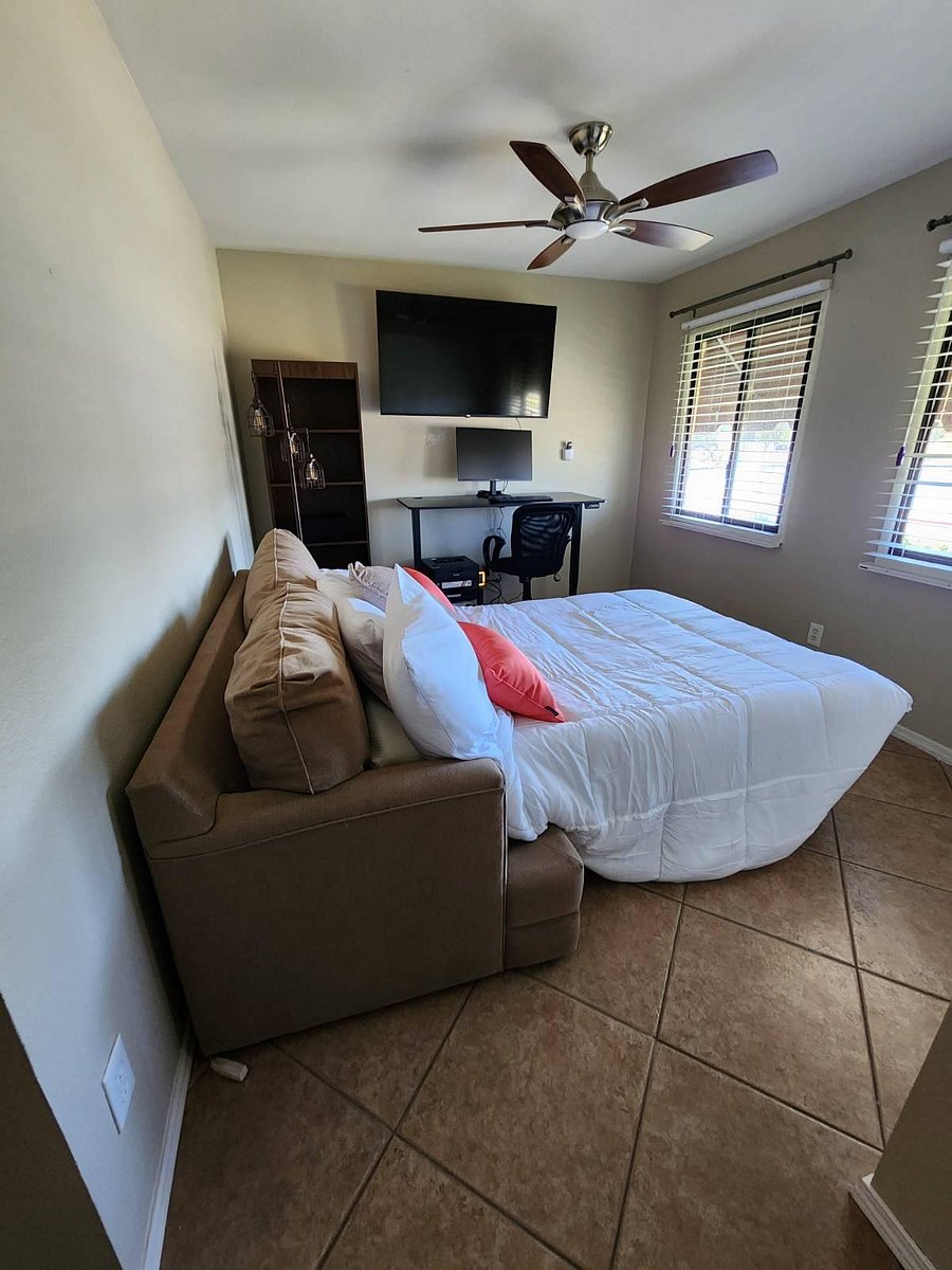 Front lake-view bedroom with sofa bed. Or close bed and use as an office with electrical adjustable desk and chair.