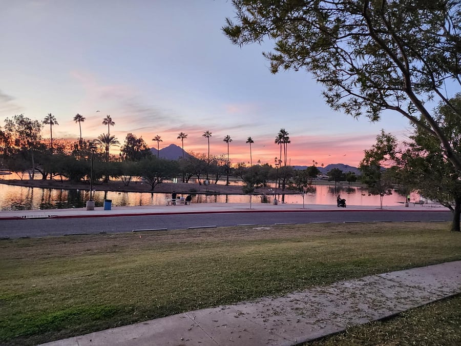 Beautiful living room view of Chaparral Park and Camelback Mountain at sunset.