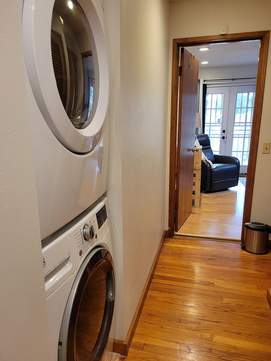 Stackable washer-dryer  with secure access from your room to the hallway.