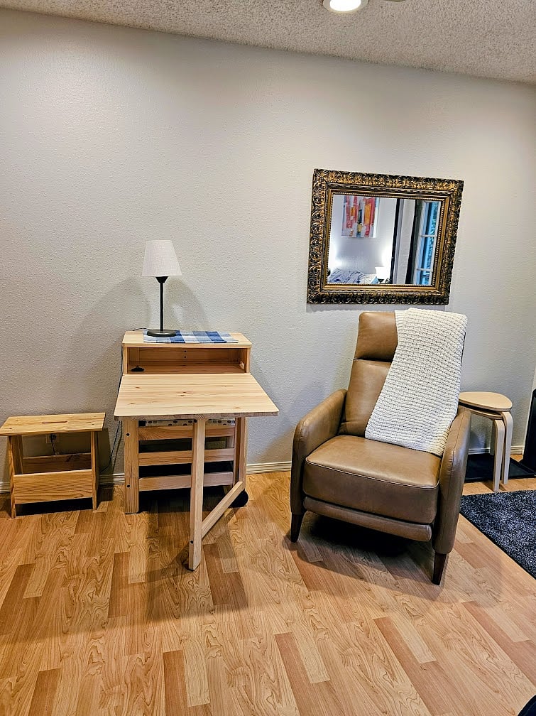 Comfortable push-back recliner with 2 level multifunctional table/desk and 3 storage cubbies