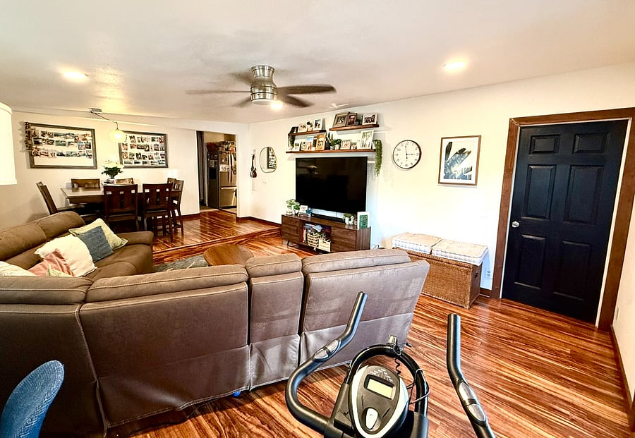 Black door leads to the master bedroom. Down the hall from the kitchen is another bathroom, and the remaining 3 bedrooms of the house. 