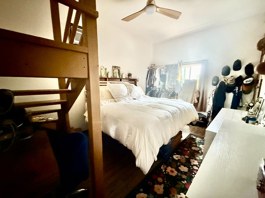Master bedroom - use of clothing rack, dresser, AC, ceiling fan.