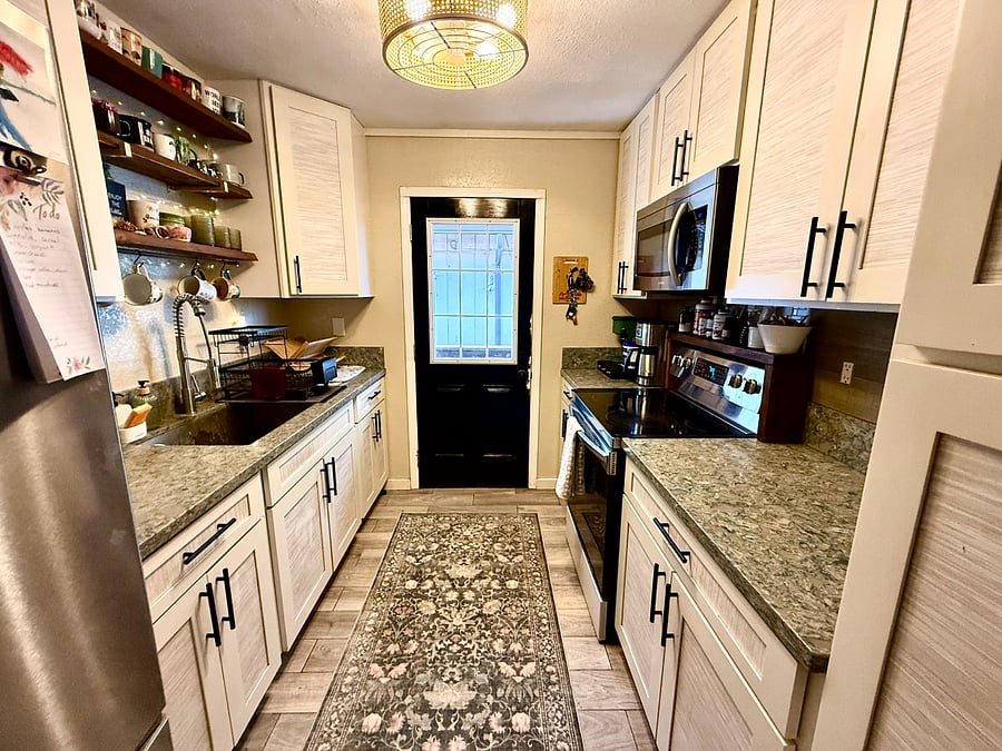 Quartz kitchen countertops with stainless steel appliances