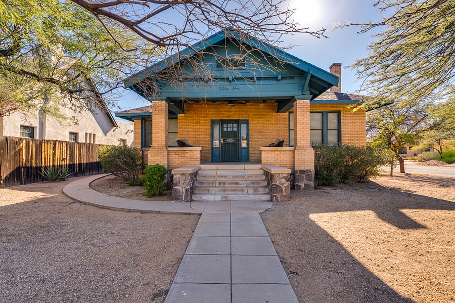 Classic 1909 architecture with a welcoming front porch and timeless curb appeal.