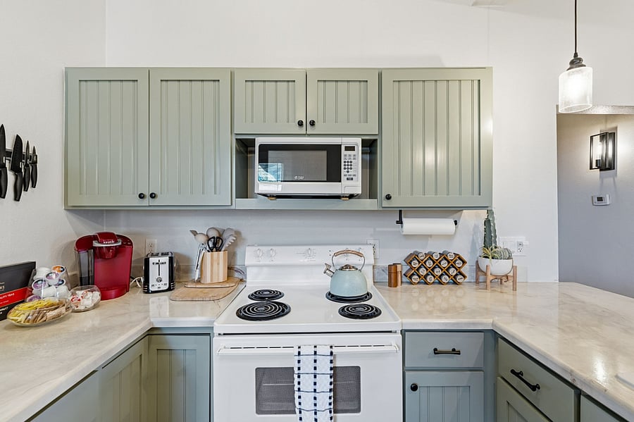 Thoughtfully appointed kitchen with everything you need for cooking, baking, or whipping up your favoritesincluding small appliances like a blender and toaster oven.