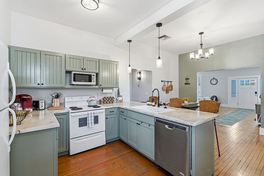Open kitchen and dining area with bar seatingideal for morning coffee, casual meals, or keeping the chef entertained.
