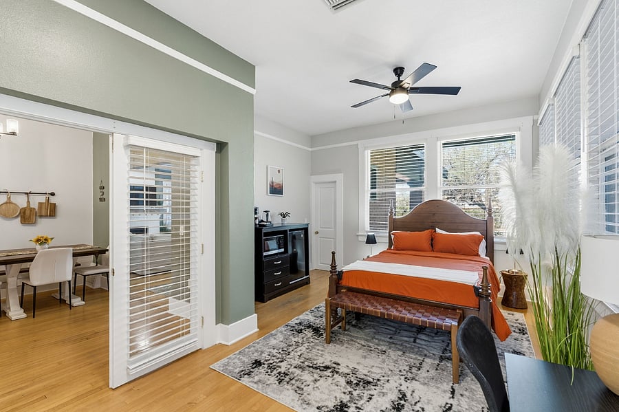 Bright, spacious primary suite with a luxury adjustable bed, walk-in closet, kitchenette, and workspaceyour own retreat within the home.