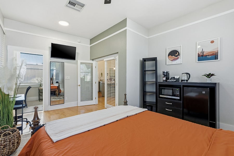 In-suite kitchenette with mini fridge, microwave, Keurig coffee station with starter supplies, and dishware; toaster oven available upon request.