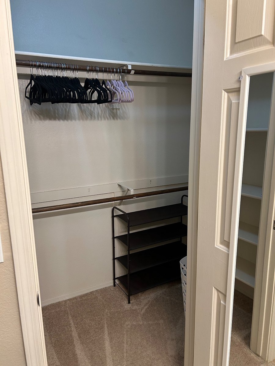 Master bedroom walk in closet with generous storage space