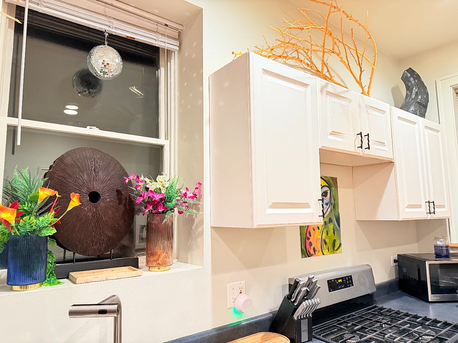 Prepare meals with ease in a fully stocked kitchen featuring cookware, dishes, utensils, a coffee maker, refrigerator, and toaster.