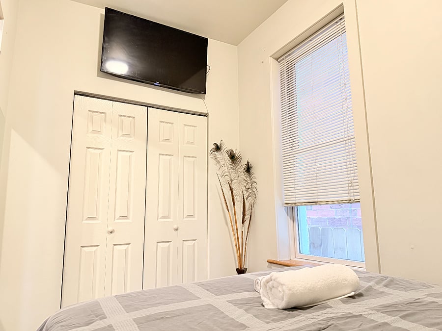 Comfortable bedroom with a double bed, soft linens, TV, wardrobe and a peaceful atmosphere for a restful nights sleep.
