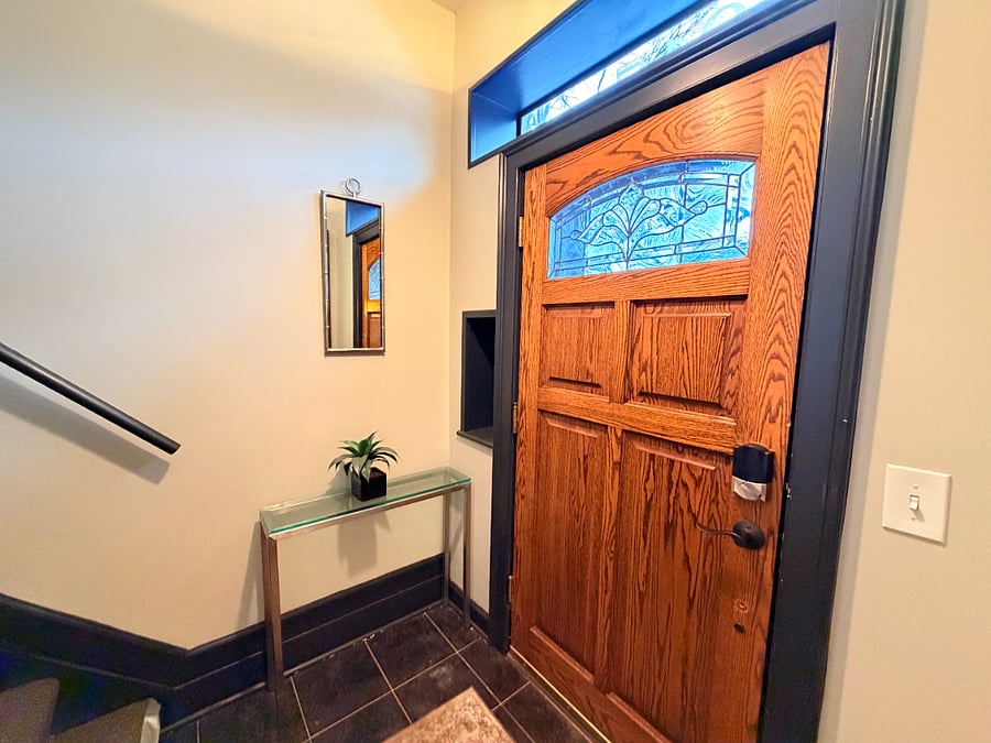 Your home away from home starts right here. A beautifully crafted wood door with elegant stained glass welcomes you into a warm and stylish space perfect for your getaway.