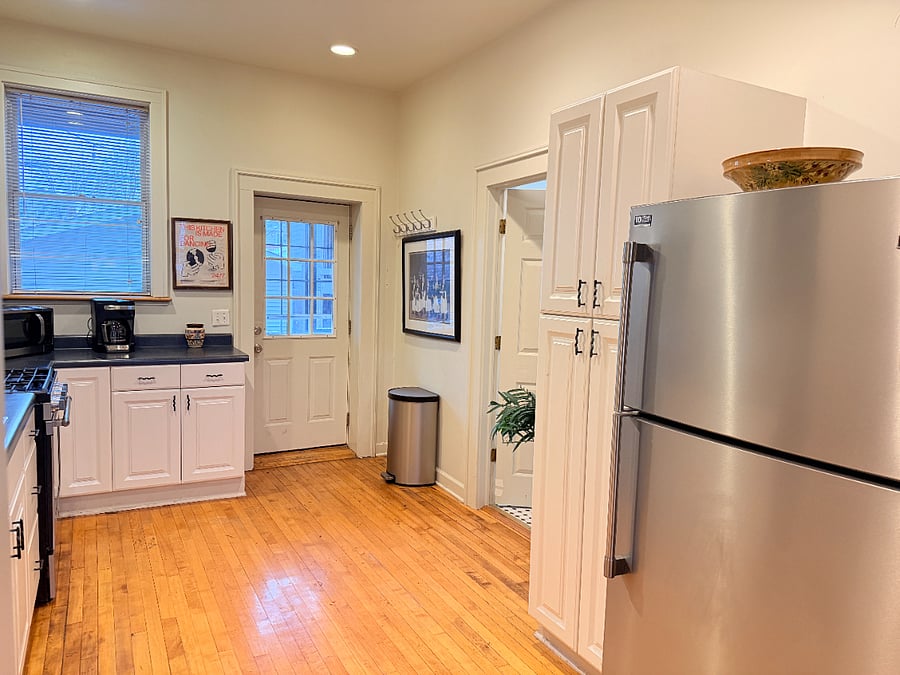 Prepare meals with ease in a fully stocked kitchen featuring cookware, dishes, utensils, a coffee maker, refrigerator, and toaster.