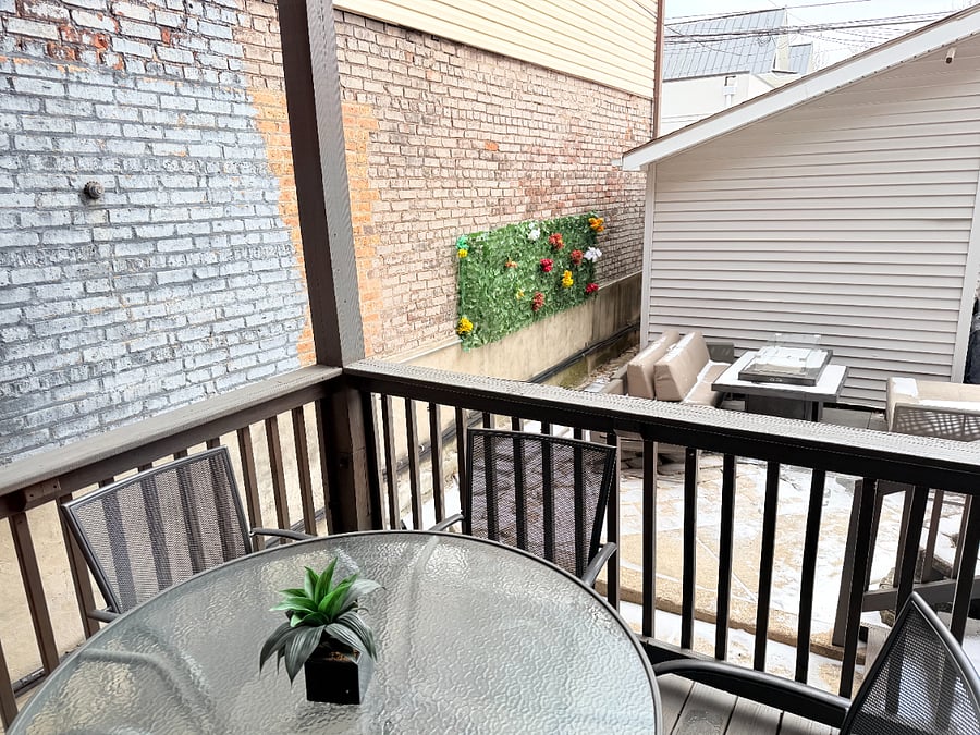 Private patio with outdoor seating, firepit and BBQ, perfect for relaxing or enjoying a meal outside.