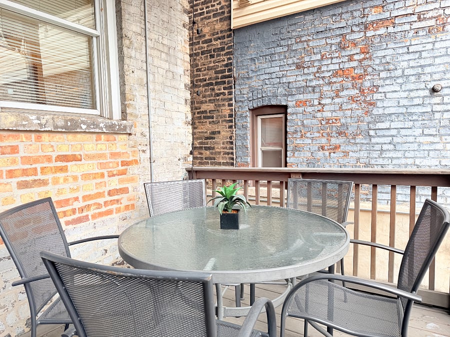 Private patio with outdoor seating, perfect for relaxing or enjoying a meal outside.