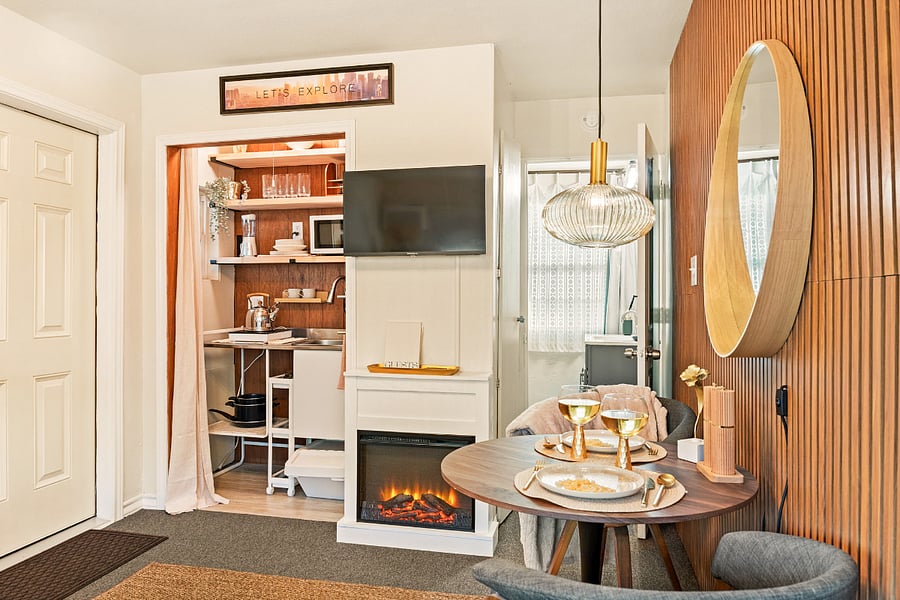 Experience the beauty of our open concept studio, where convenience meets comfort. This thoughtfully designed space allows everything to be within reach, creating a seamless flow between the living, dining, and sleeping areas. Enjoy cozy evenings by the electric fireplace, adding warmth and ambiance to your stay. The smart TV offers entertainment at your fingertips, making it easy to relax and unwind.
This studio is perfect for those seeking a harmonious blend of functionality and style.