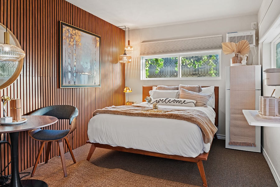 Step into a tranquil retreat with warm colors that envelop you in comfort. Bright light fills the room, enhancing its welcoming vibe. The spacious bedroom features a luxurious bed with a premium Beautyrest mattress, ensuring a restful night's sleep. Convenient light switches are located by the bed for easy access, while a white noise maker creates a soothing atmosphere for ultimate relaxation. To enhance your comfort, blackout curtains provide complete privacy and darkness, allowing you to recharge fully. This serene space is designed for your relaxation and rejuvenation.