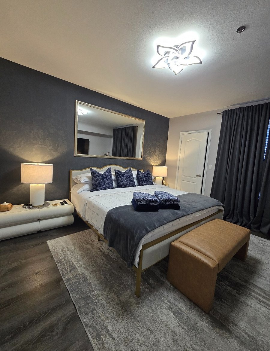 Elegant bedroom featuring a plush king-size bed, very comfortable mattress, and a spacious walk-in closet