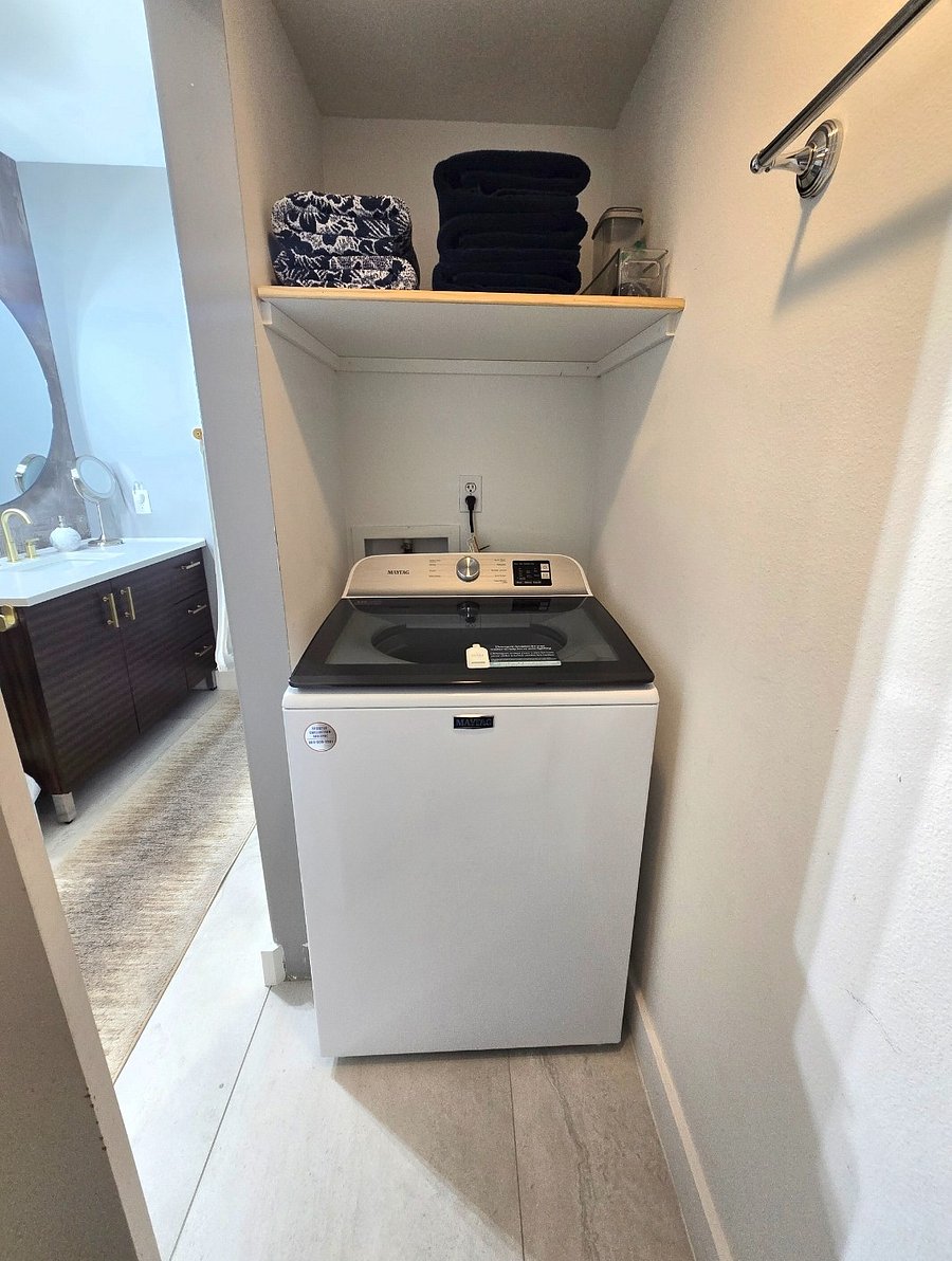 Full-size washer and dryer conveniently located inside the unit.