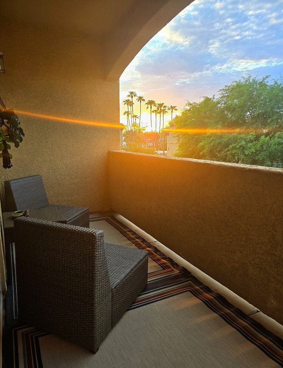 Private balcony with seating perfect for relaxing or enjoying a good book.