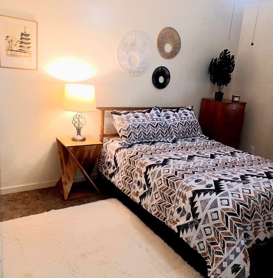 Bedroom 2 with full size bed, nightstand, chest of drawer and private entry into Bathroom 2