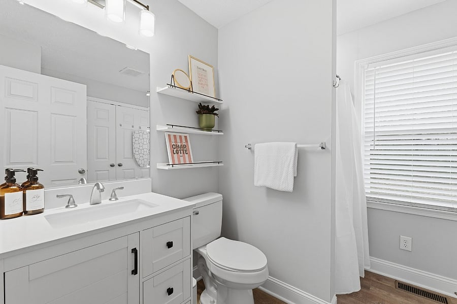 Ensuite bathroom off Bedroom one - laundry room located here as well