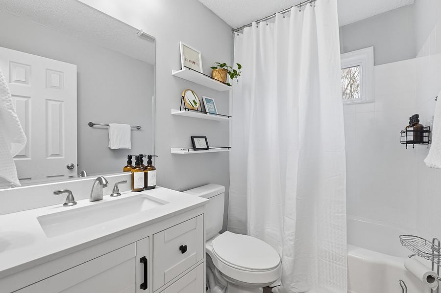 Main house bathroom includes soaps, shampoo, conditioner, hair dryer, and plenty of towels