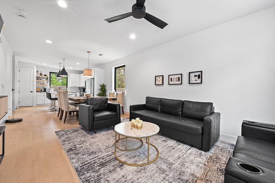 Living Room Sofa sleeper comfortable for 2 Storage in all couches Throw blankets Mini couch pillows Wall art USB and USB-C Outlets 75" TV X Box One with vintage games Board games Remote controlled candles