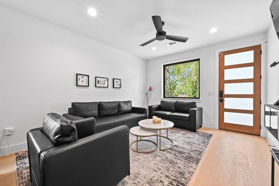 Living Room Sofa sleeper comfortable for 2 Storage in all couches Throw blankets Mini couch pillows Wall art USB and USB-C Outlets 75" TV X Box One with vintage games Board games Remote controlled candles