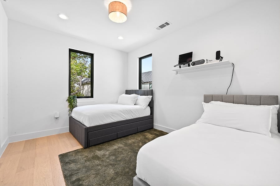 Full Bed with pull out twin size trundle Twin bed 120" remote controlled projector screen Projector with USB-C & USB connections Amazon Fire Stick Blackout blinds Extra bedding USB and USB-C Outlets Extra storage under trundle and twin bed 5' iPod Mirror