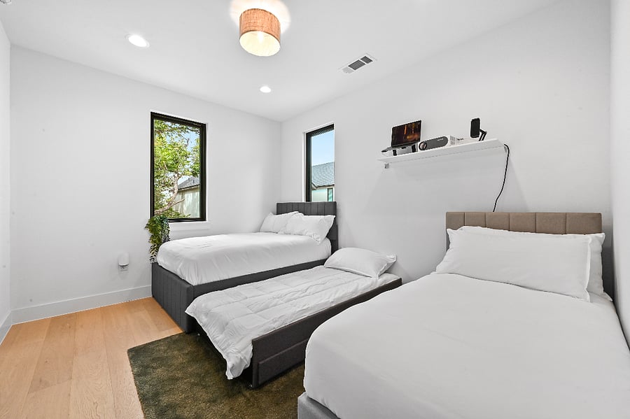 Full Bed with pull out twin size trundle Twin bed 120" remote controlled projector screen Projector with USB-C & USB connections Amazon Fire Stick Blackout blinds Extra bedding USB and USB-C Outlets Extra storage under trundle and twin bed 5' iPod Mirror