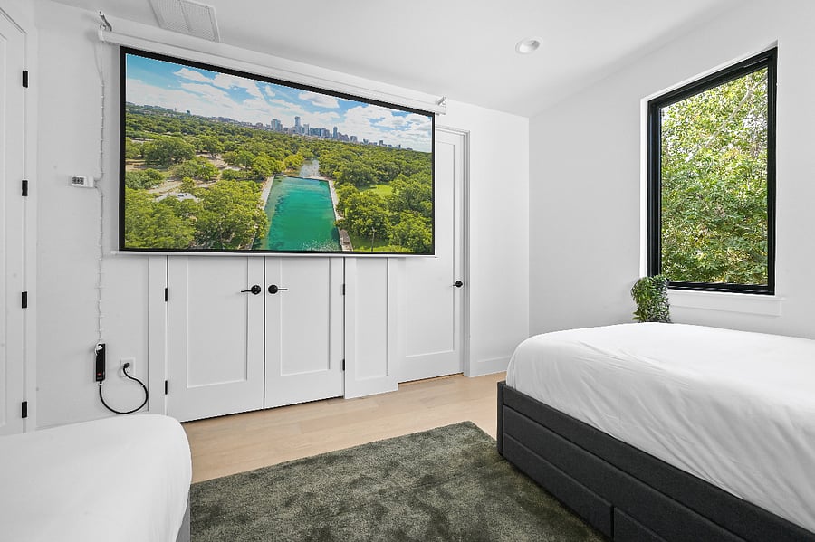 Full Bed with pull out twin size trundle Twin bed 120" remote controlled projector screen Projector with USB-C & USB connections Amazon Fire Stick Blackout blinds Extra bedding USB and USB-C Outlets Extra storage under trundle and twin bed 5' iPod Mirror