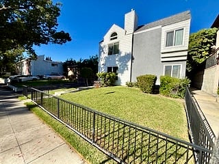 Enclosed side yard with private access to unit D.