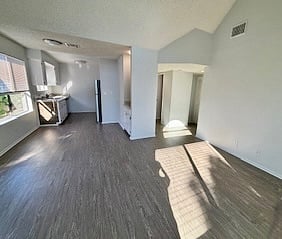 Interior before furnishings showing hallway to laundry, bedrooms and bathrooms.