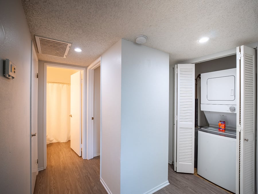 Laundry with starter lundry soap. Hallway to bedroom 2 and bathroom.