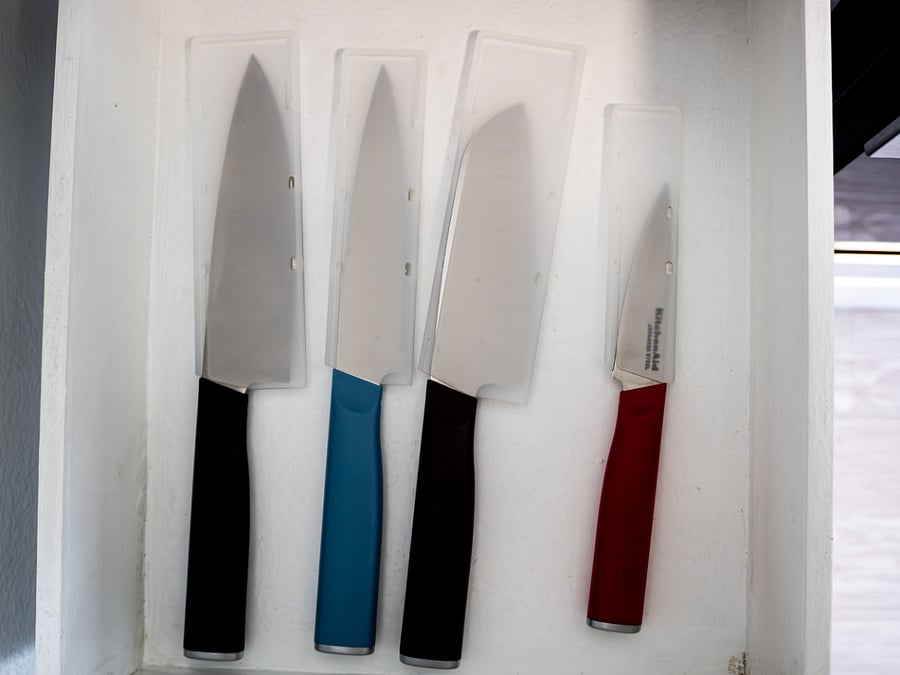 Kitchen knives with blade sleeves