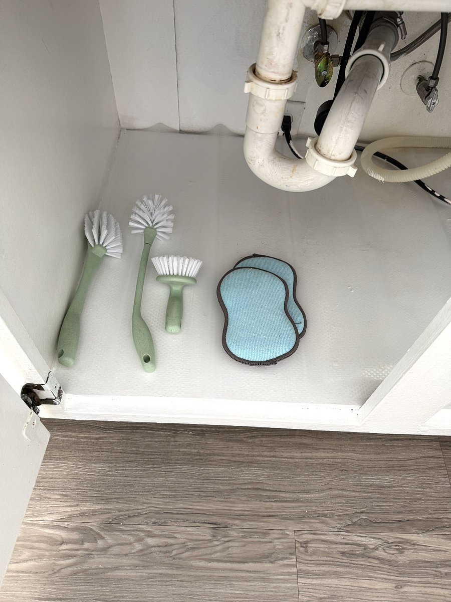 Glass and cup scrubbers, sponges under the kitchen sink.
