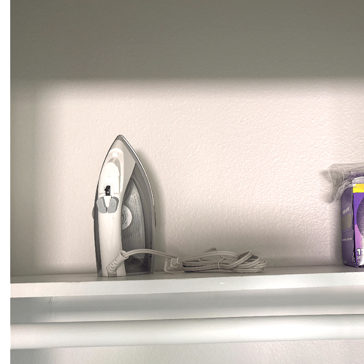 Hall closet with iron.