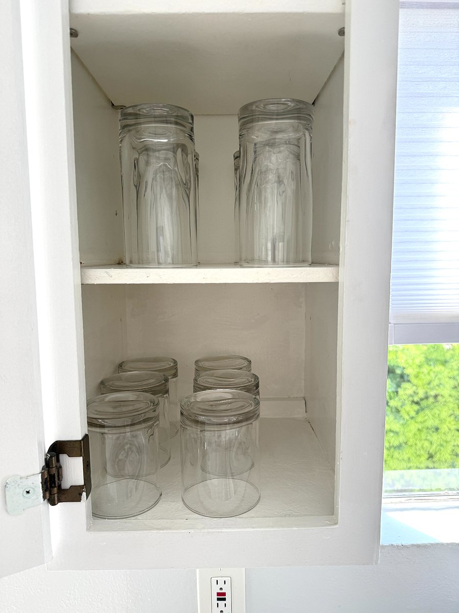 Short and tall tumblers in kitchen cabinet