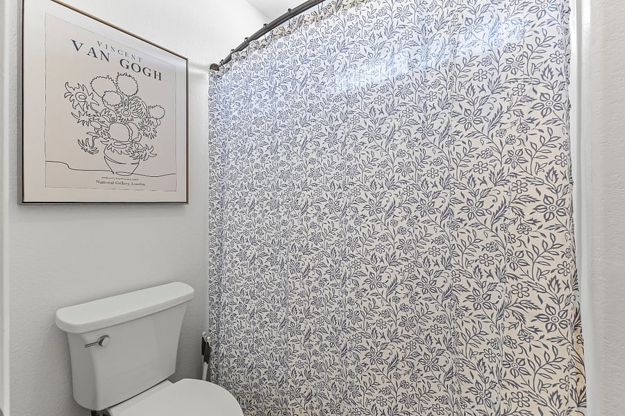 Full shower and toilet in the main bathroom. 