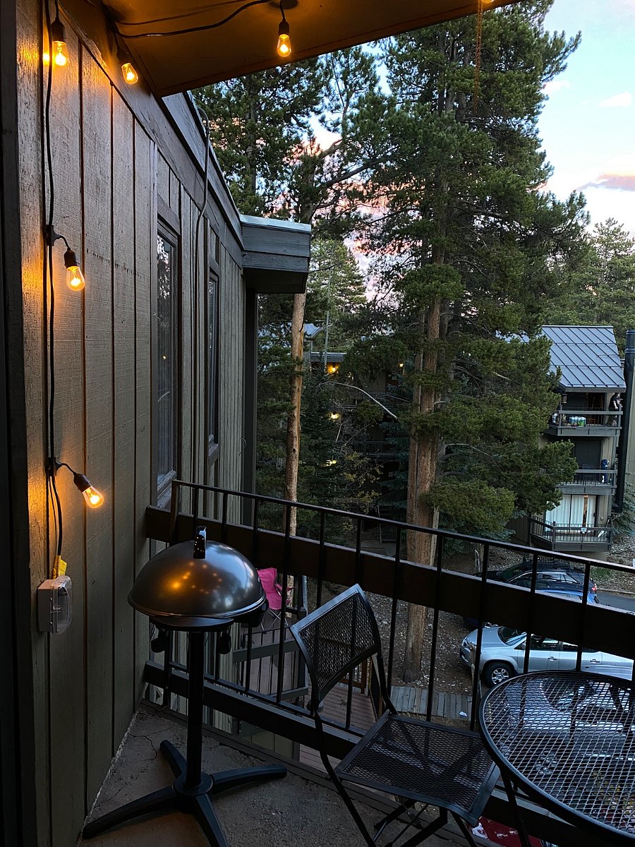 Private Balcony with bistro table, string lights and electric grill - perfect for unwinding.