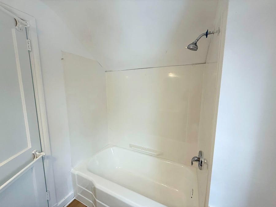 Clean and modern bathroom with updated finishes and stylish lighting