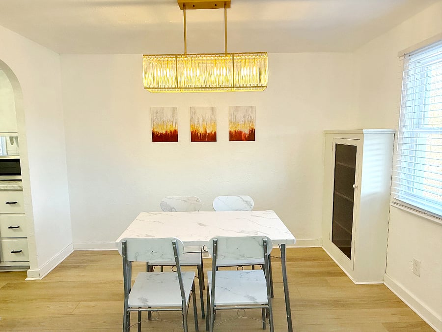 Dining table with cabinet and modern art