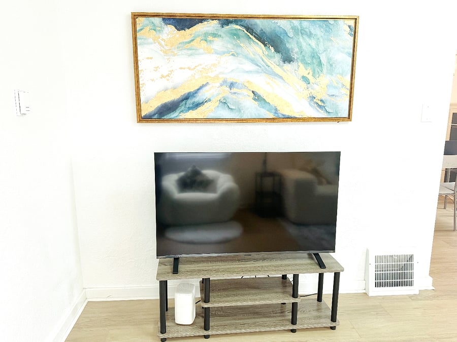 50 inch Toshiba Smart TV and modern artwork, creating a clean and relaxing space
