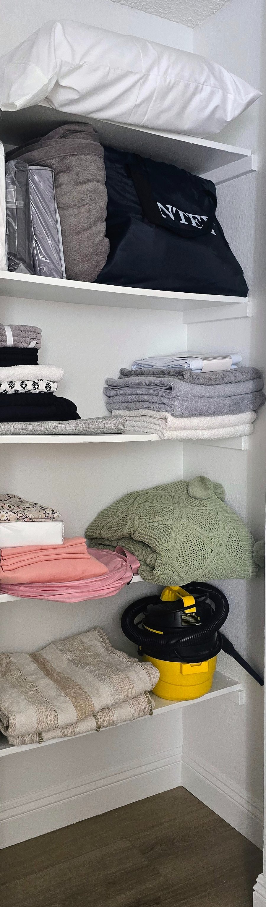 Additional Bedding and Inflatable Bed for Visitor, Closet includes ironing board and Iron in Hallway closet.