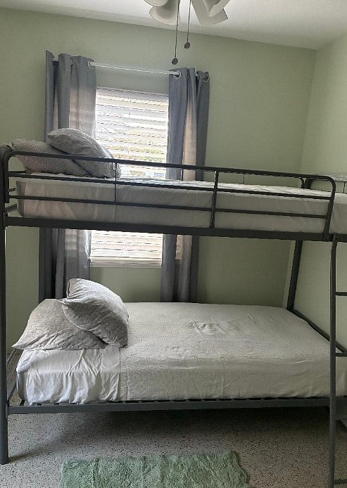 Guest bedroom/office area, bunk beds on porous floors will stain terrazzo floors