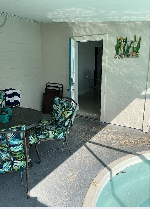 Screened-in swimming pool area off of dine room