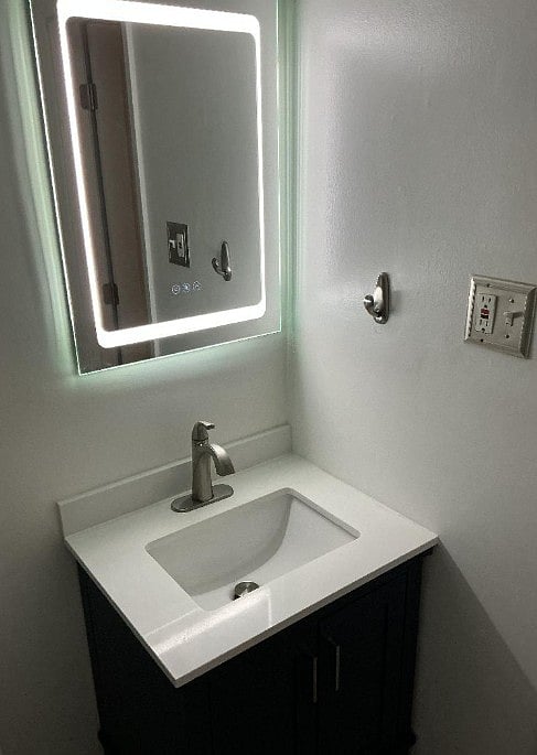 Single Bathroom
 Small Blue Vanity with hair dryer
LED Medicine Cabinet 
