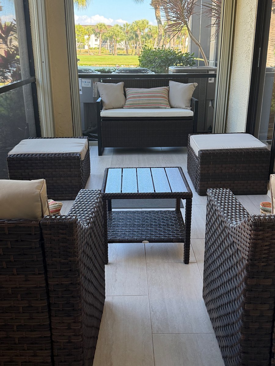 Screened in lanai with furniture you can figure for your needs.